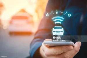 Connected car security showing vehicle dashboard with digital network icons representing data protection and cybersecurity systems.