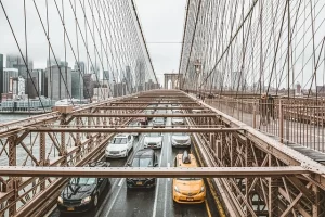 Cars on a bridge representing evolving urban transport and micromobility trends USA.