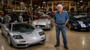 Jay Leno Car Collection displayed inside his legendary garage, featuring the McLaren F1, Mercedes-Benz 300 SL Gullwing, Ford GT and other rare collector cars.