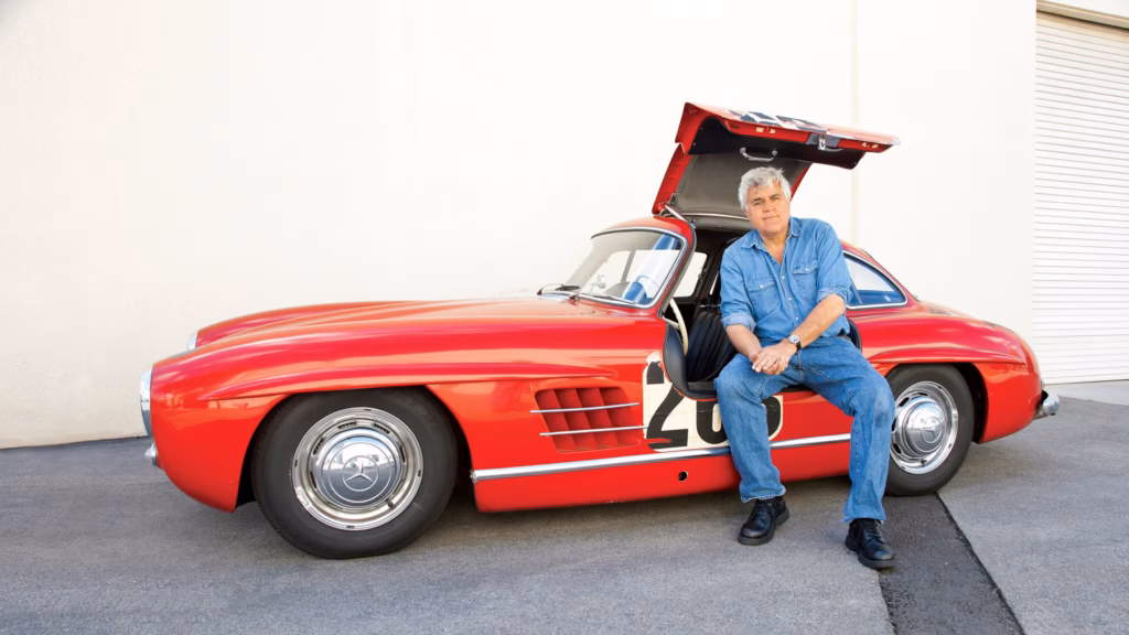 Jay Leno Car Collection featuring Jay Leno with the Mercedes-Benz 300 SL Gullwing.