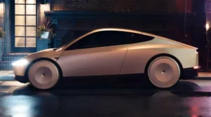 Tesla Cybercab autonomous robotaxi shown in side profile on a city street