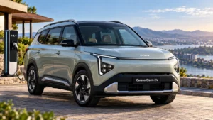 Kia Carens Clavis EV parked at a charging station overlooking a lake