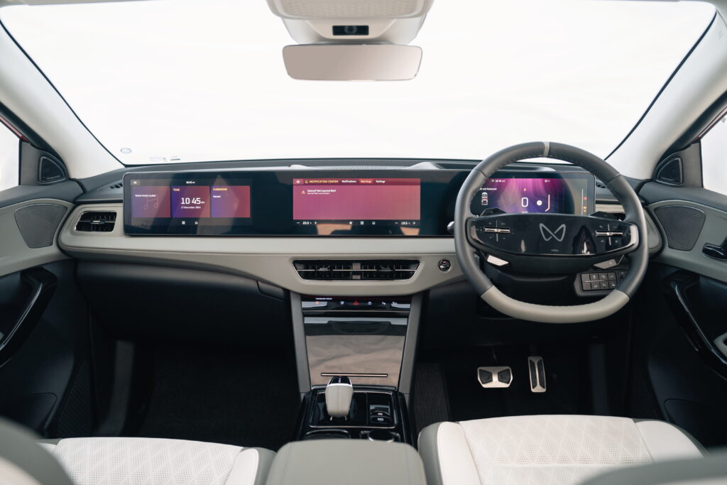 Mahindra XEV 9e interior with triple-screen dashboard and digital displays
